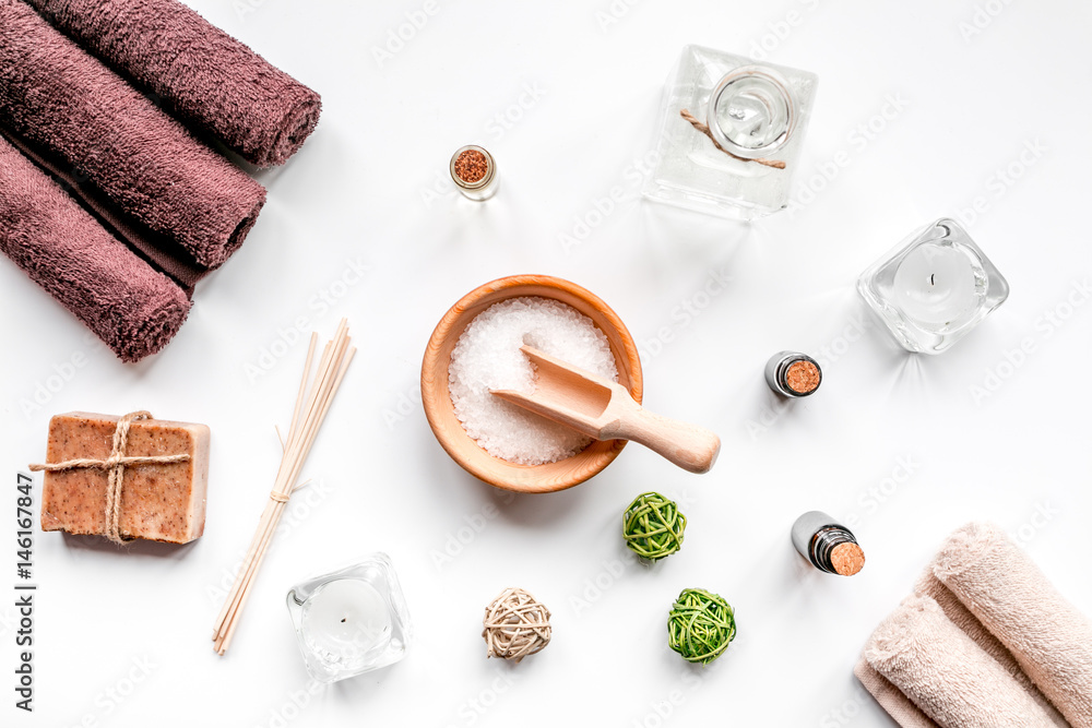 spa set with towels and soap on white background top view