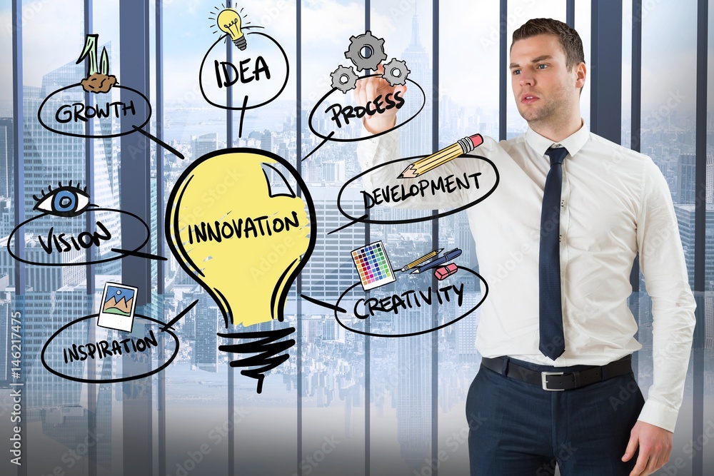 Confident businessman looking at innovation diagram in office