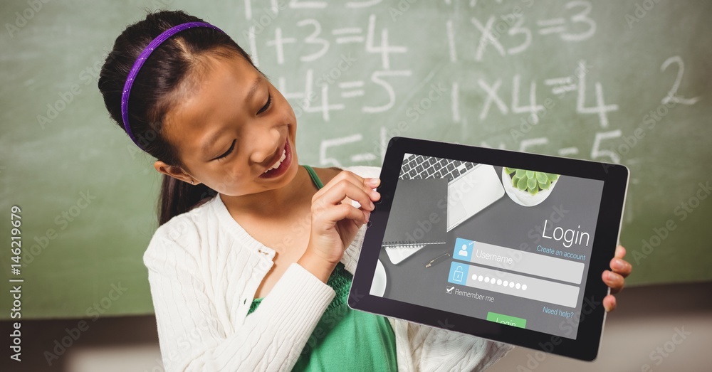 Schoolgirl looking at log in page on tablet PC