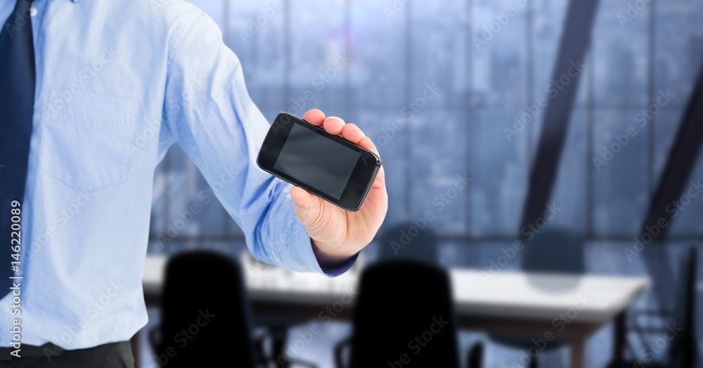 Midsection of businessman showing smart phone with blank screen