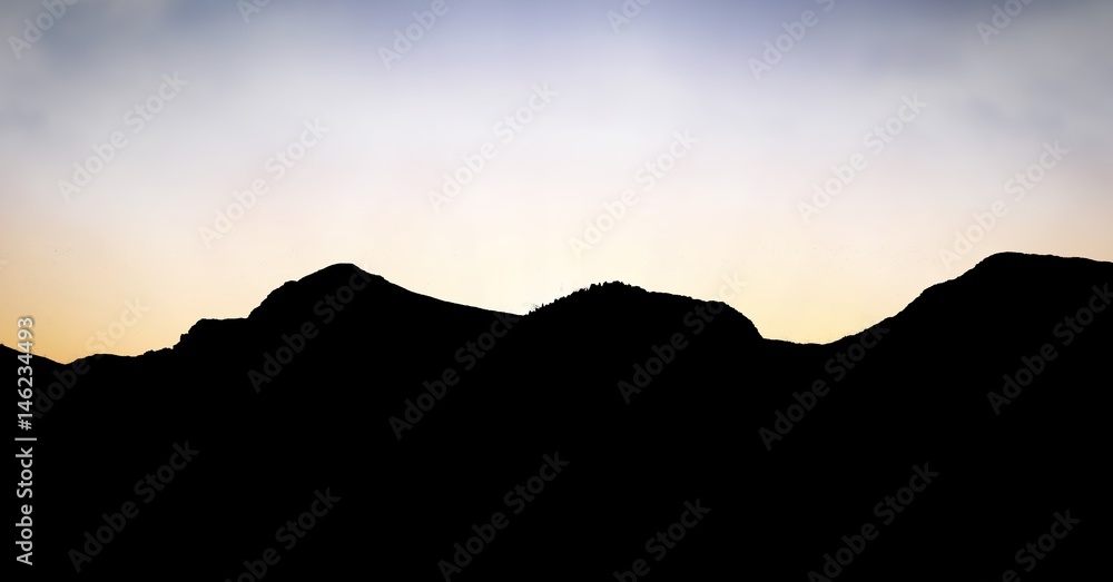 Silhouette mountains against sky