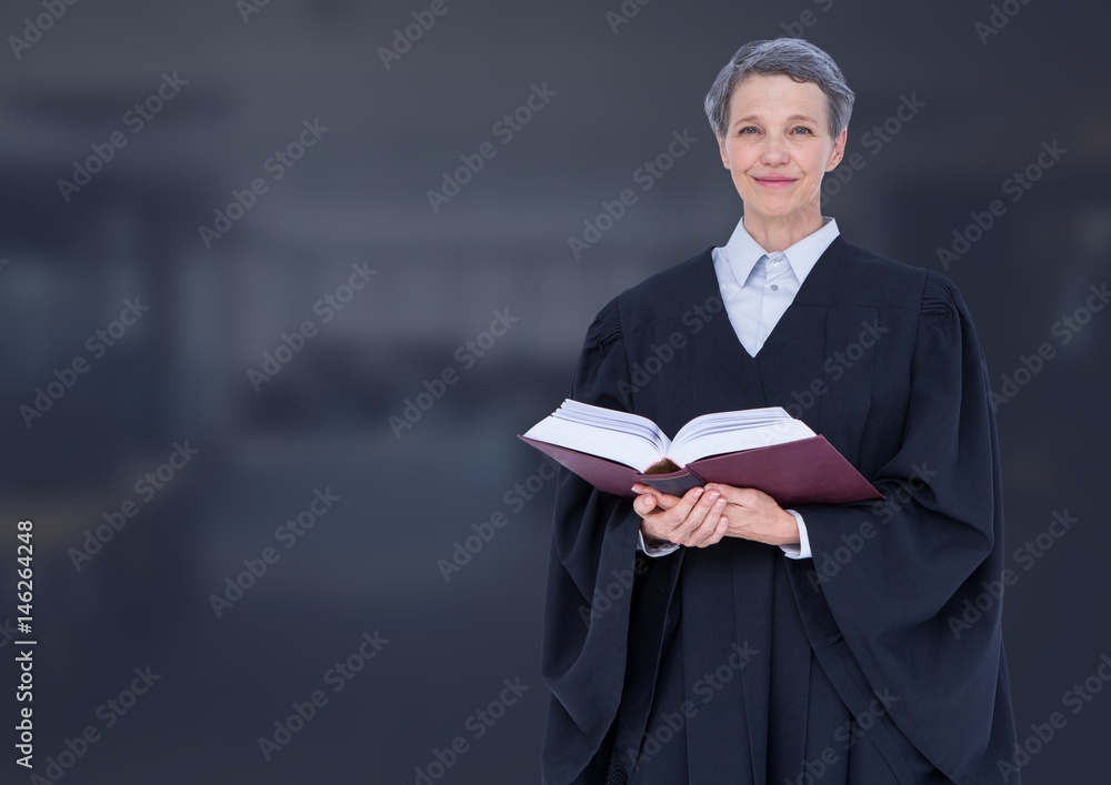 Judge holding book in front of dark office background