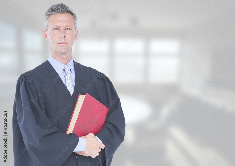 Judge holding book in front of white office