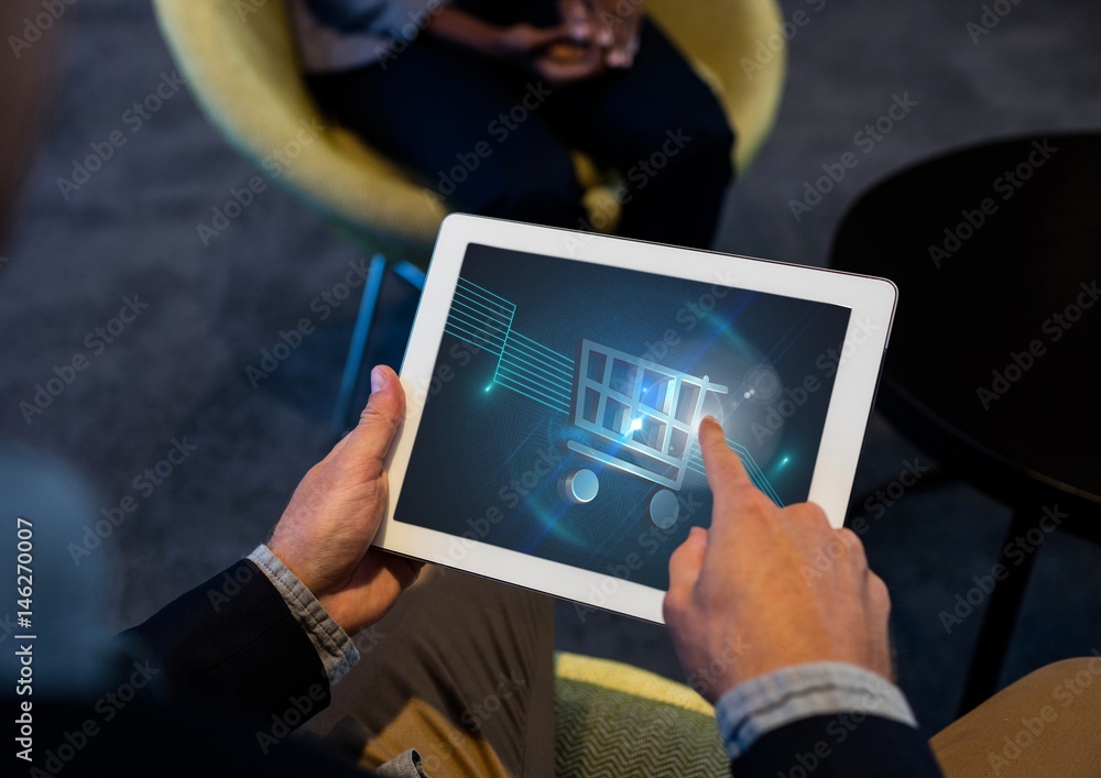 Person using Tablet with Shopping trolley icon