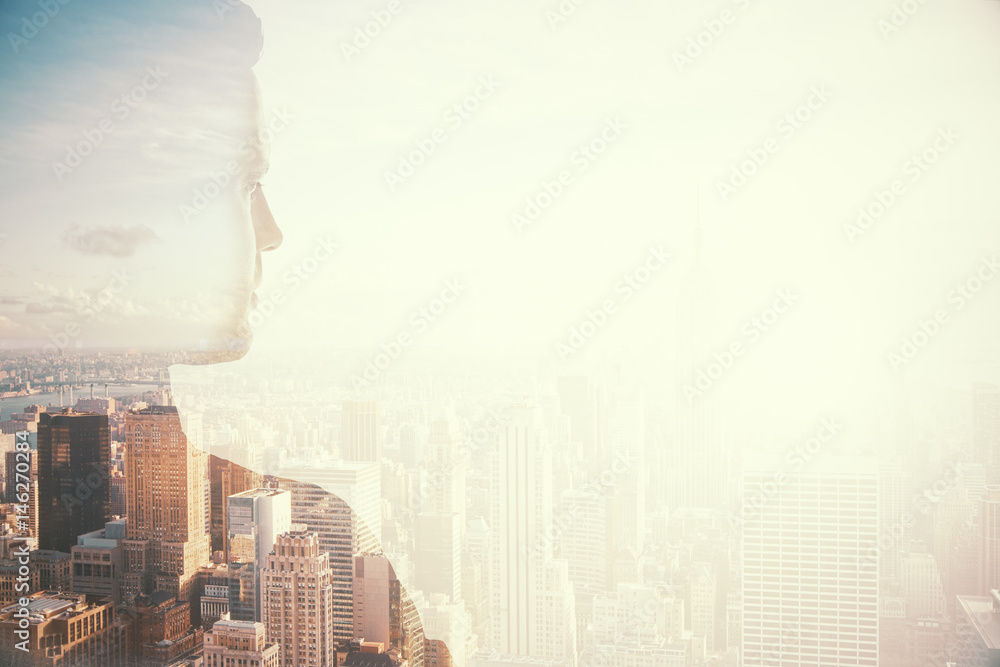 Businessman silhouette on city background