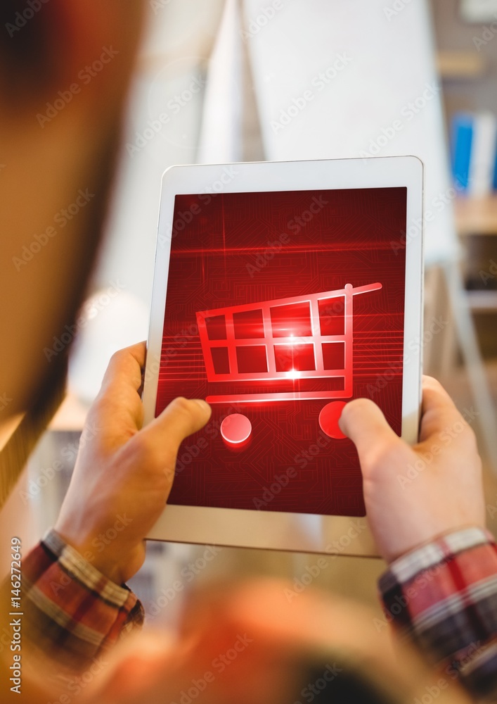 Person using Tablet with Shopping trolley icon