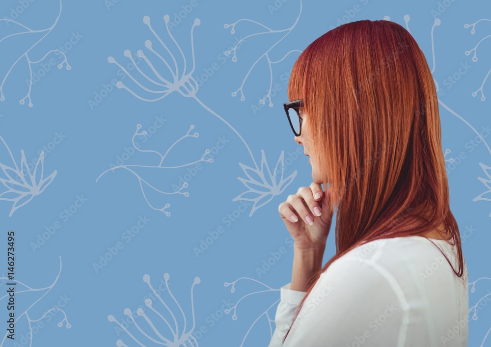 Woman profile against blue floral pattern