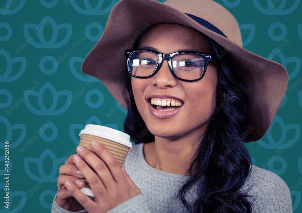 Woman in sun hat with coffee against blue floral pattern