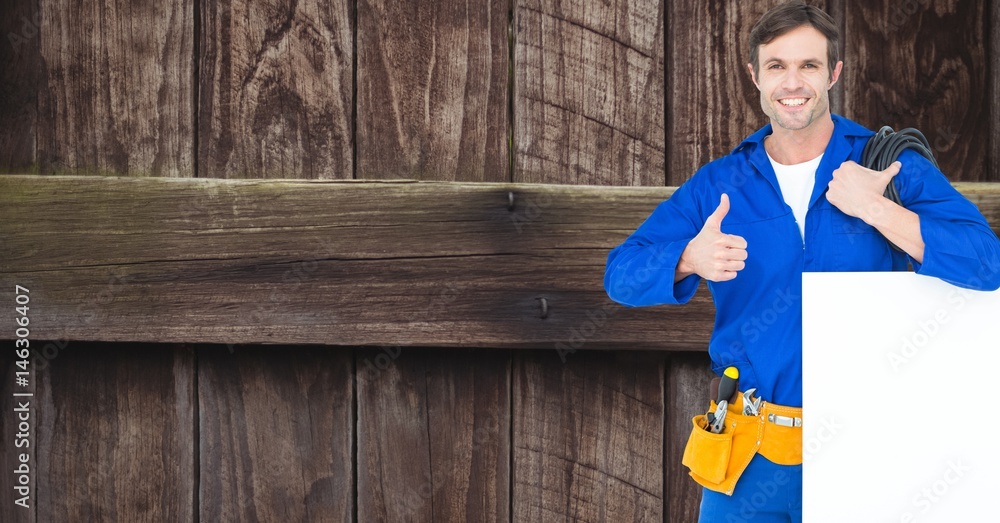 Repairman with bill board showing thumbs up sign