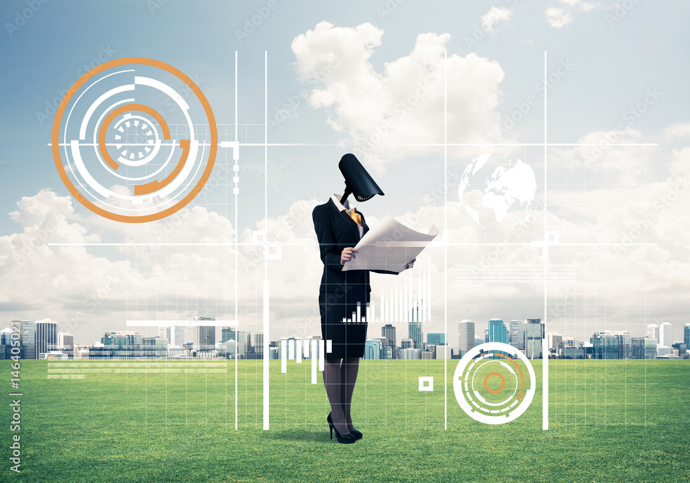 Camera headed woman standing on green grass against modern citys