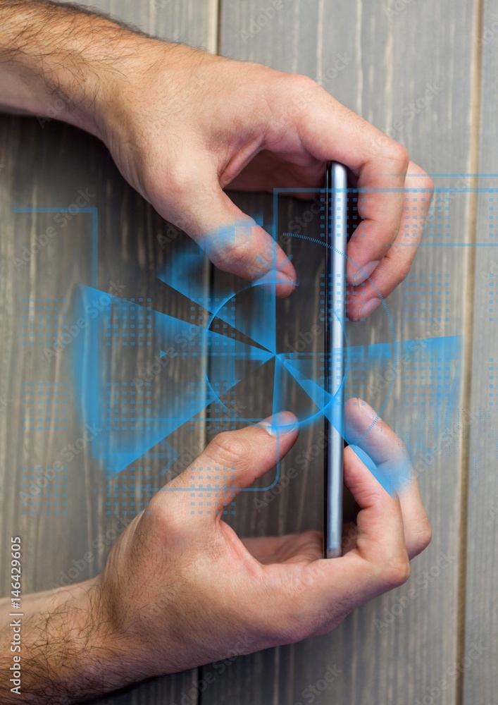 Overhead of hands with phone and blue interface