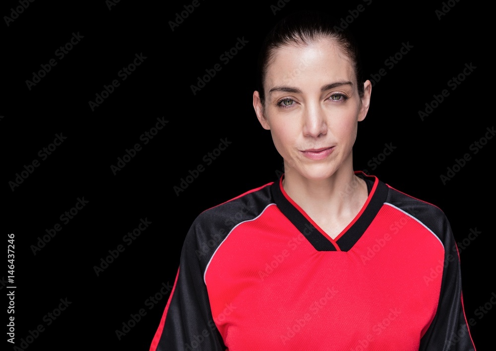 Woman in jersey against black background