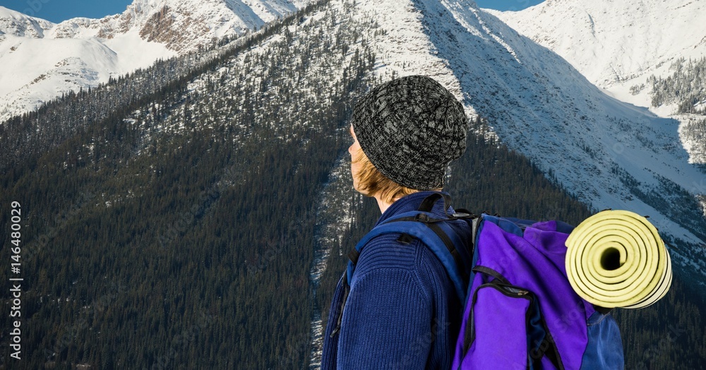 Hiker with backpack against mountain