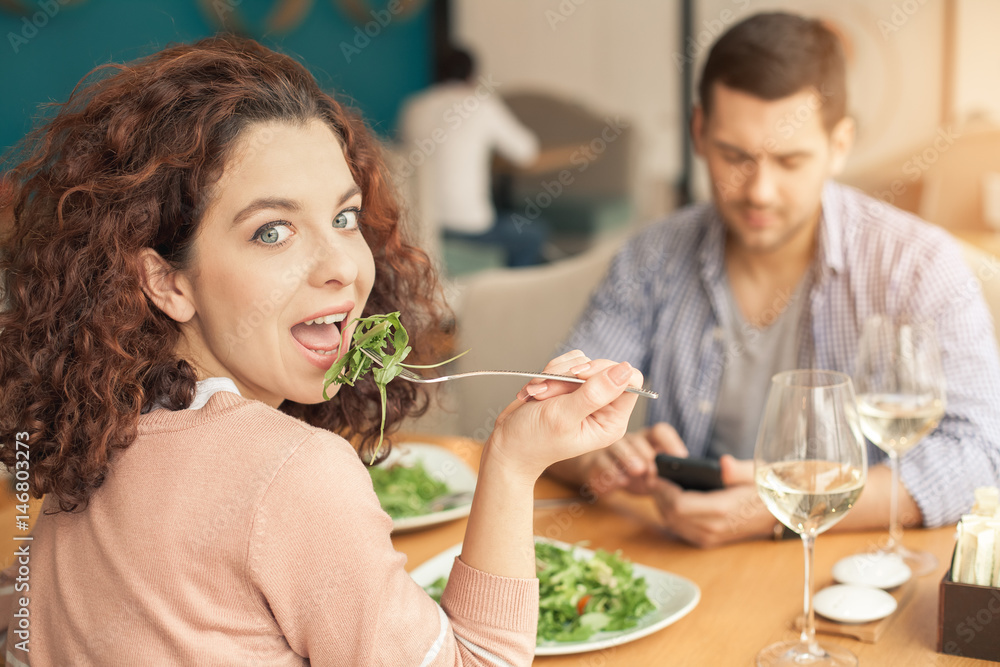 Nice looking couple in cafe