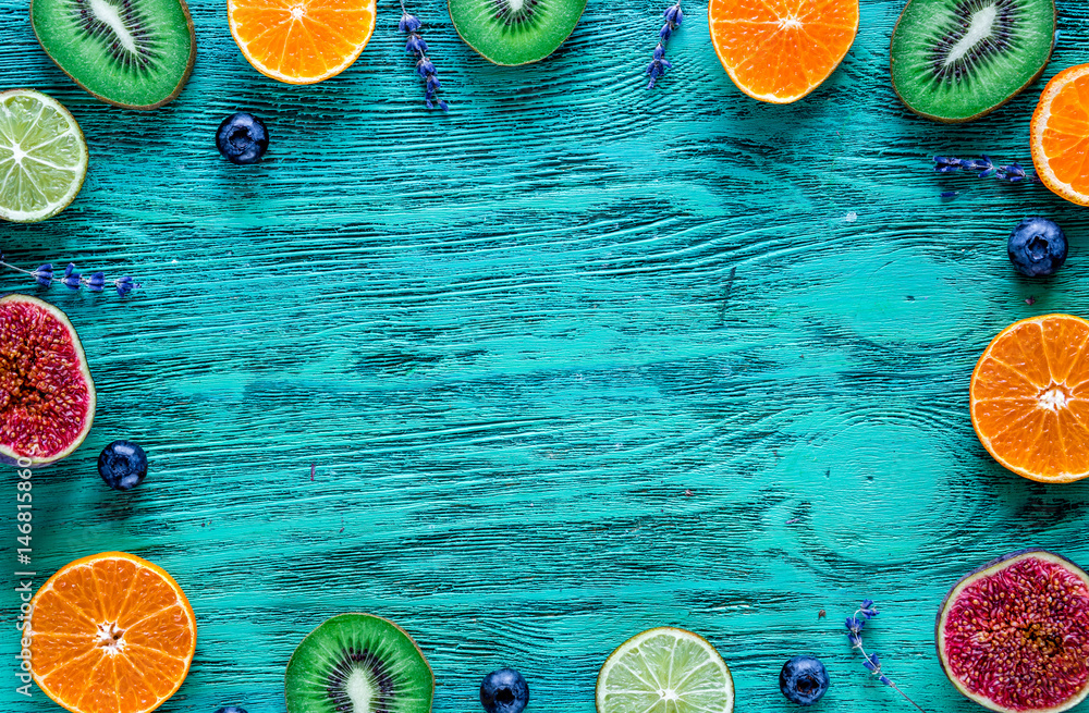 Fruit mockup with lavender and blueberry on blue desk background top view