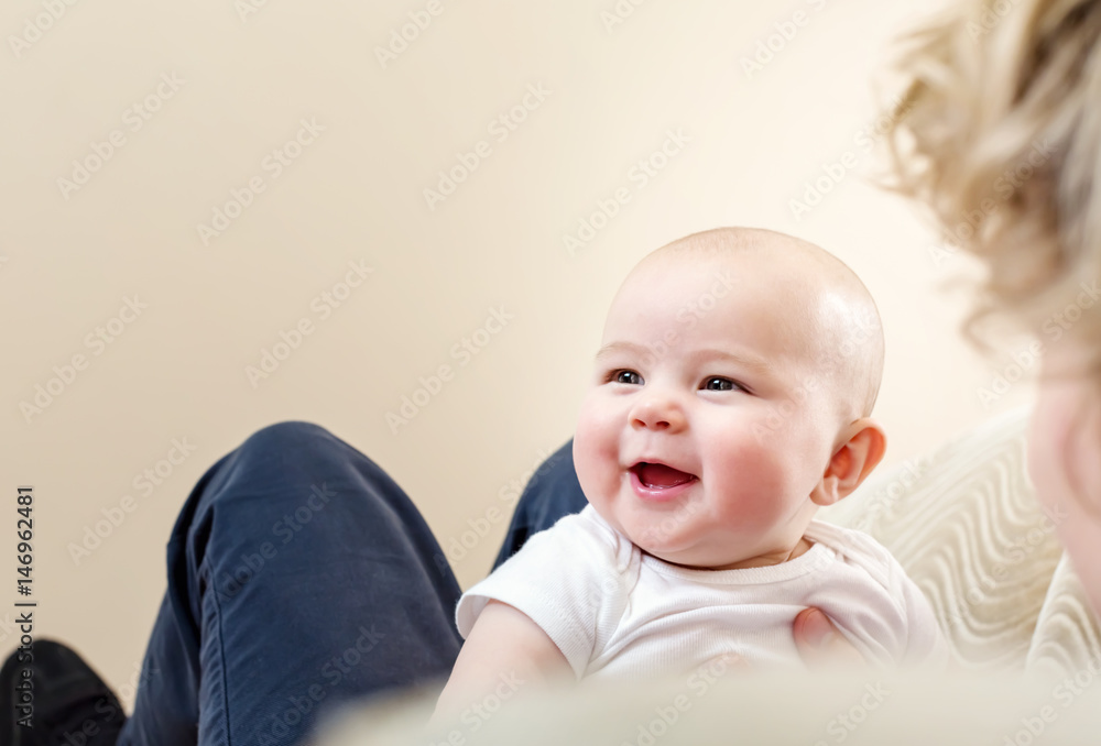 Baby girl playing with her father