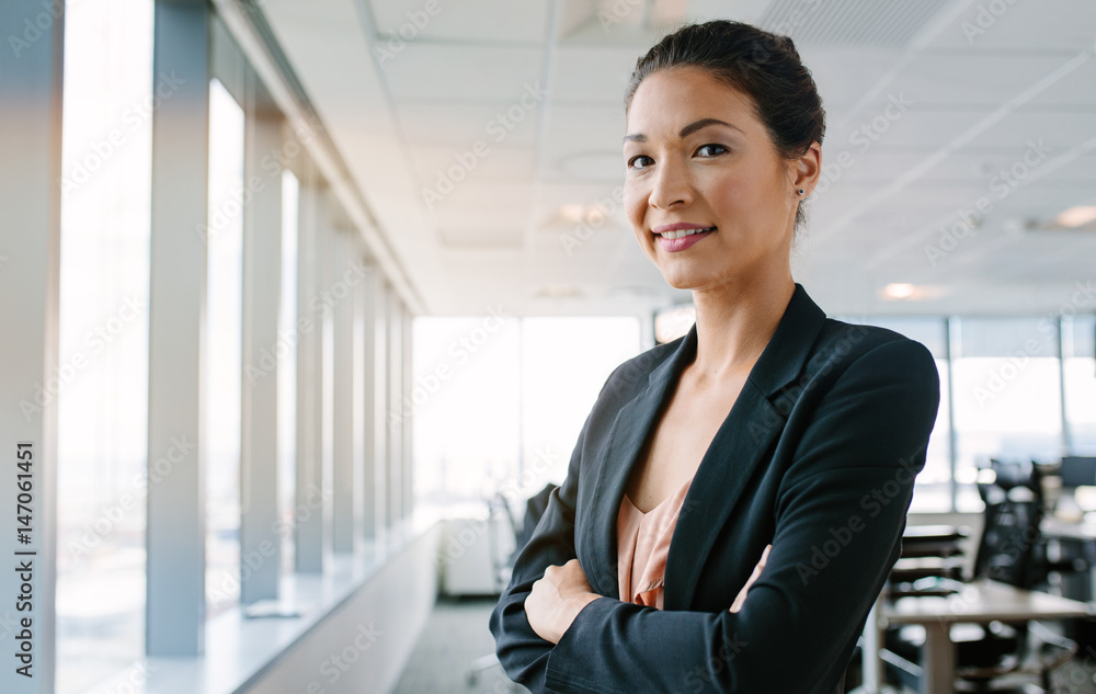 Female executive looking at camera confidently