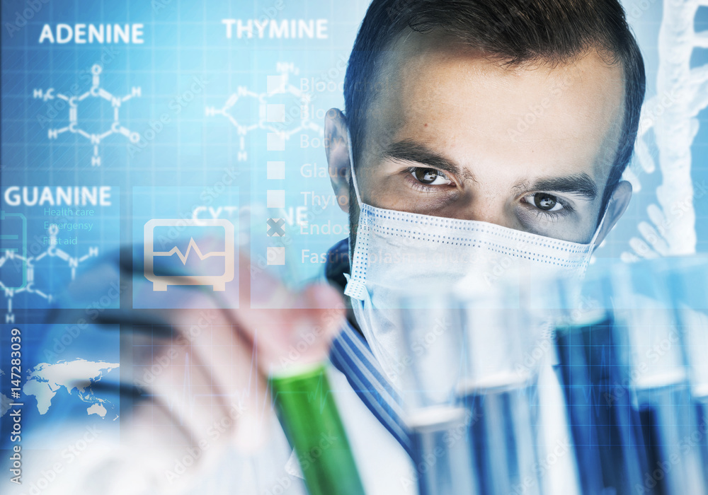 Young scientist mixing reagents in glass flask in clinical laboratory