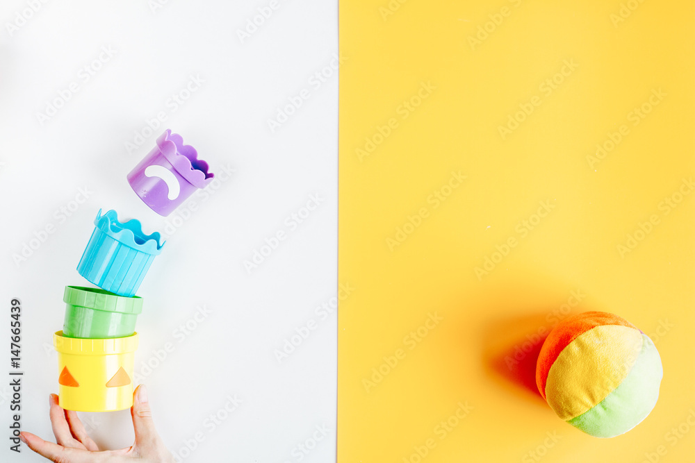 children flat lay with toys colorful background top view space for text