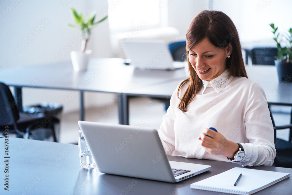 Young Businesswoman Pressing Stressball While Working in the office