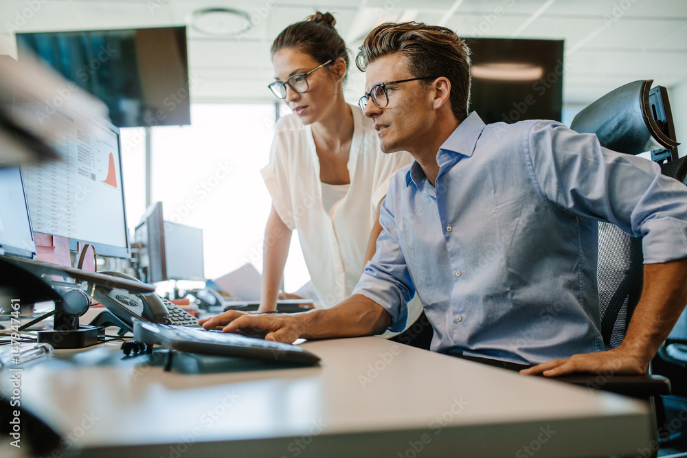 Two business colleagues working in their office