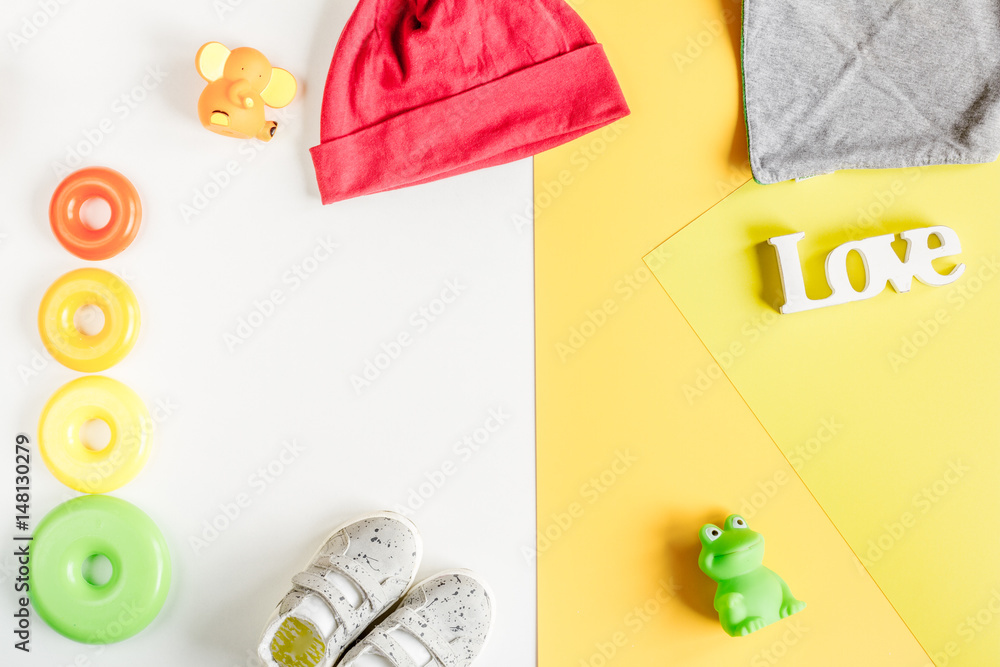 kids desk design with toys and clothes yellow white background top view mockup