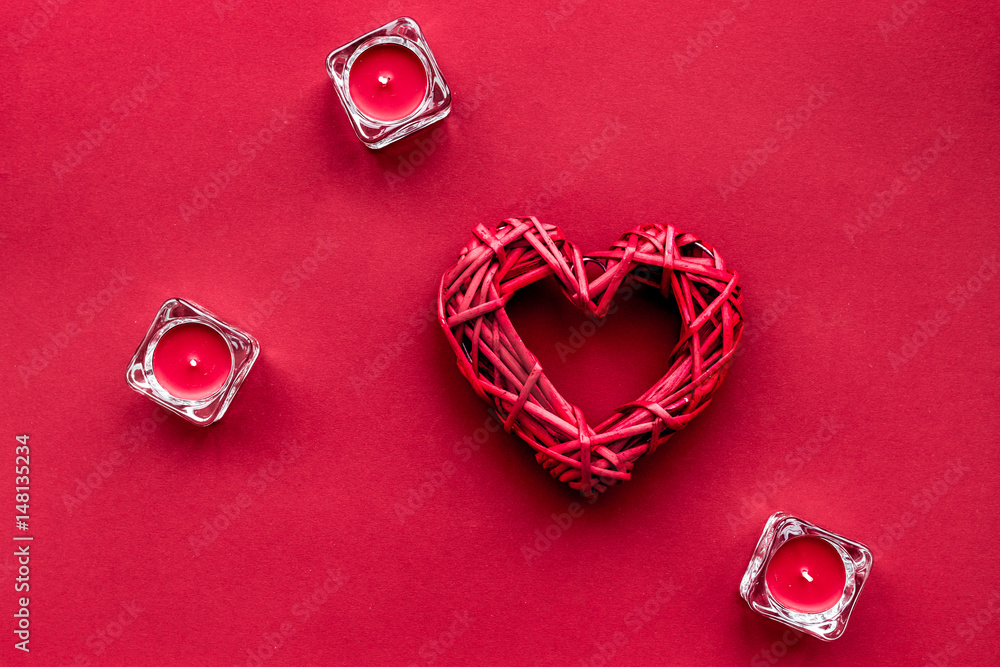 scarlet collection with candles on red colored background top view space for text