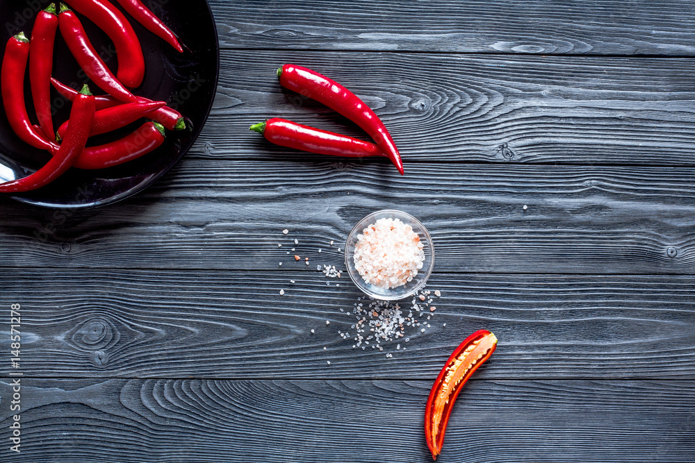 red food with chili pepper on dark background top view space for text