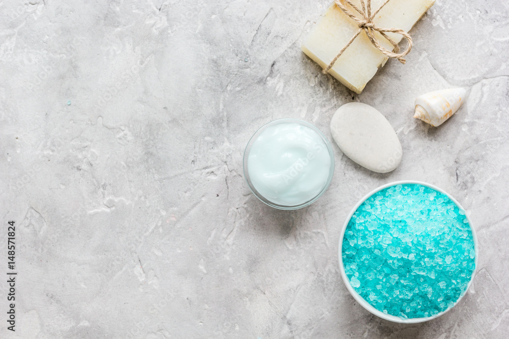 spa composition with blue salt and soap on stone background top view mockup