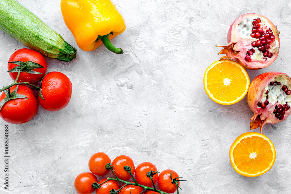 fruits and vegetables for healthy dinner on stone background top view mock up