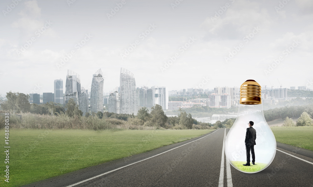 Businessman inside light bulb