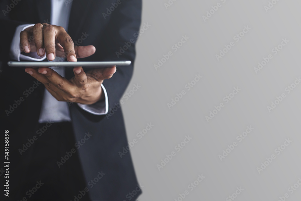 Part of Businessman using digital tablet