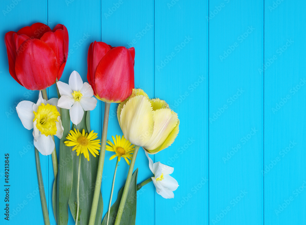 Tulips on a wooden background