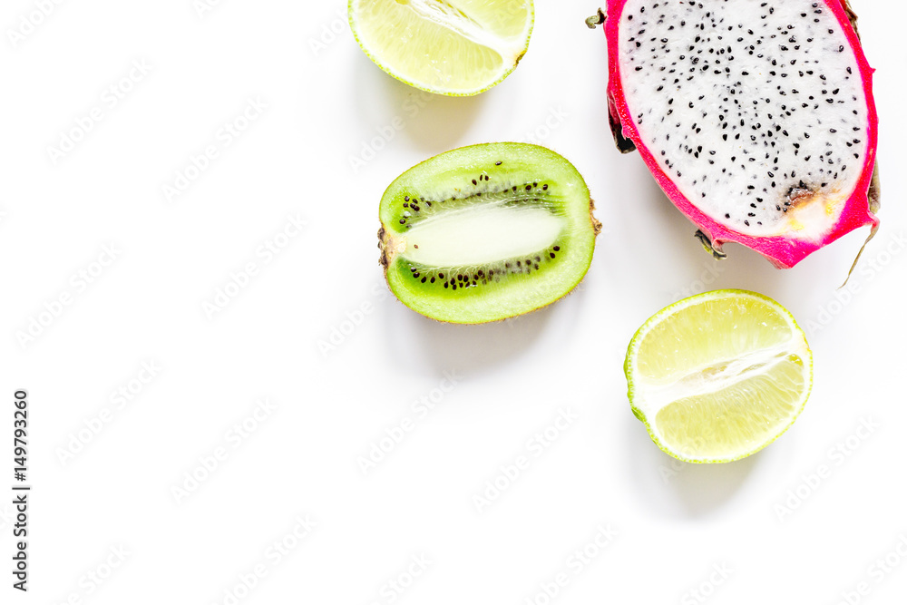 pattern with sliced kiwi and pitaya on white background top view mockup