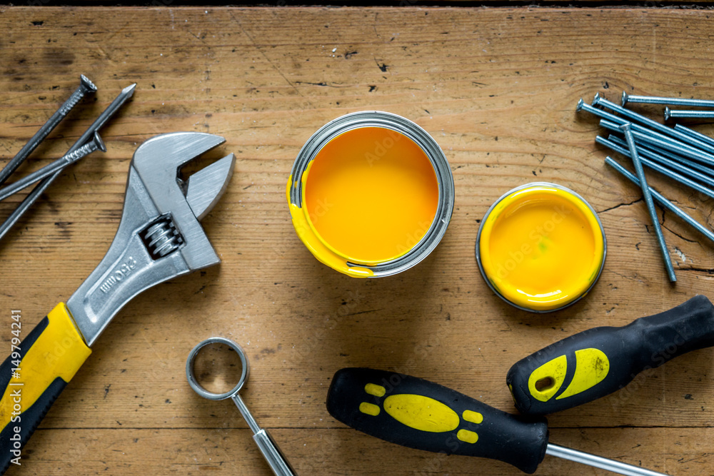 building implements set for repair on wooden background top view