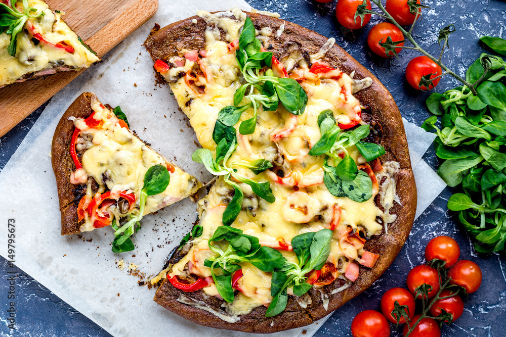 cooking pizza with vegetables and cheese on stone desk background top view