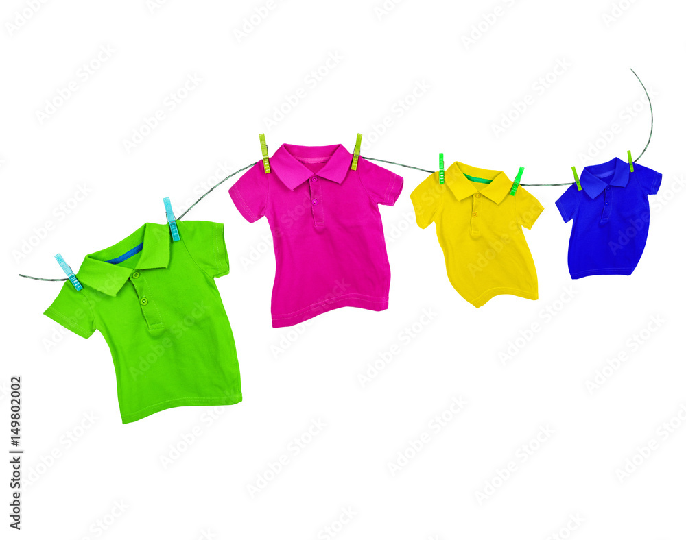 Laundry line with colored t-shirts on a white background