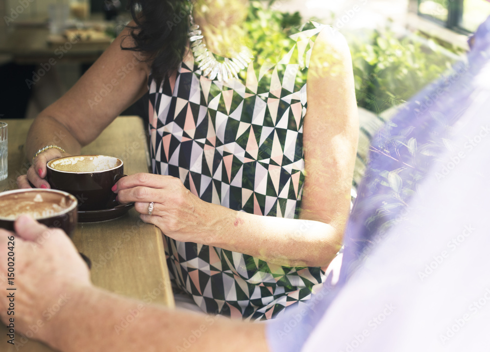 Mature couple drinking coffee together