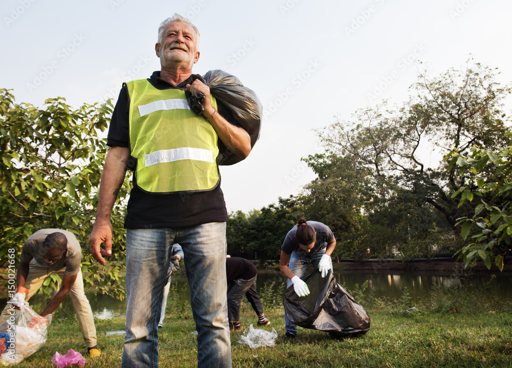 Ecology group of people cleaning the park