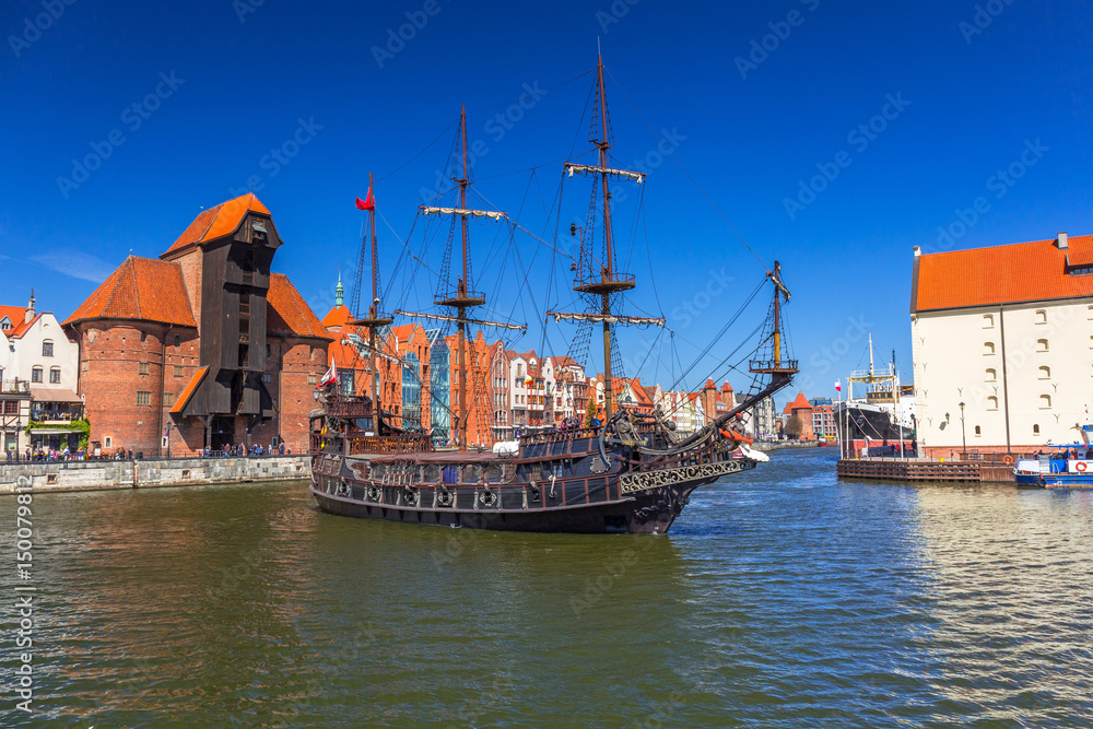 Pirate ship and historic port crane at Motlawa river in Gdansk, Poland