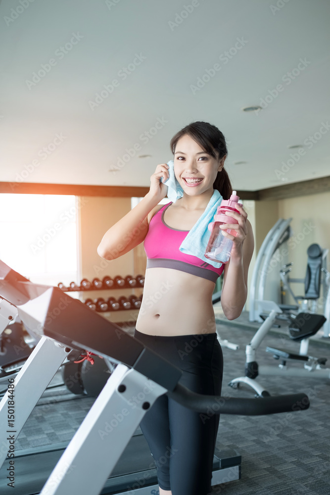 woman stand on treadmill