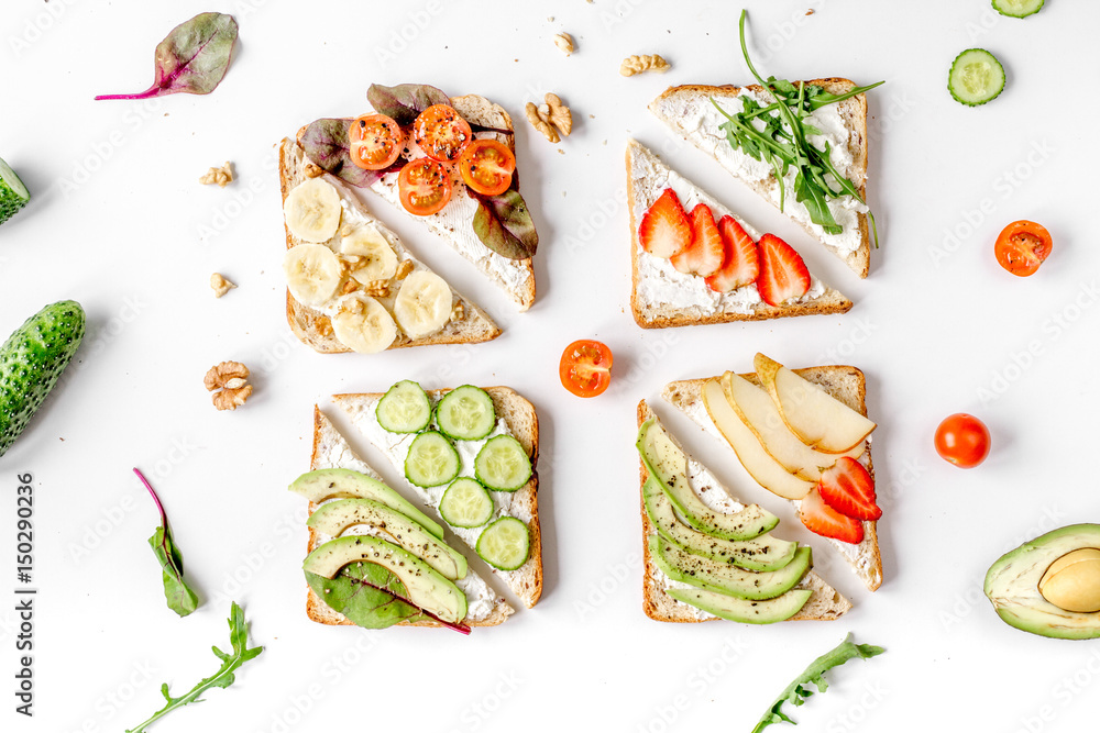 fitness breskfast with homemade sandwiches white table background top view