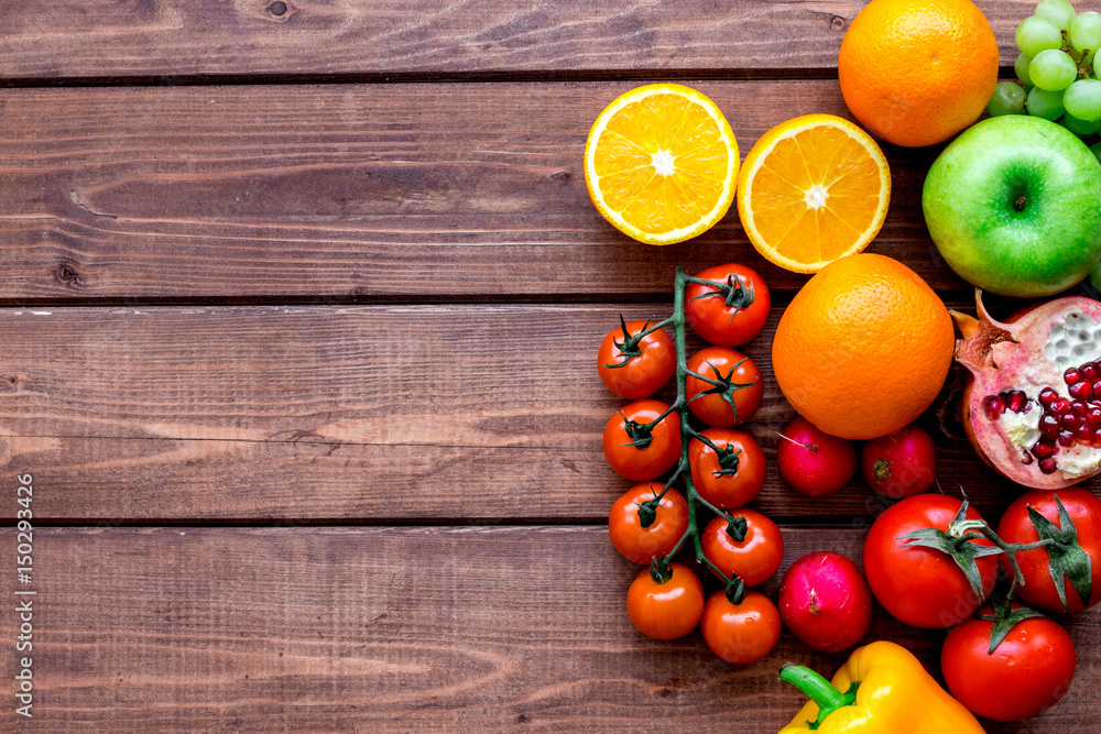 fresh vegetables and fruits for fitness dinner on wooden background top view mockup