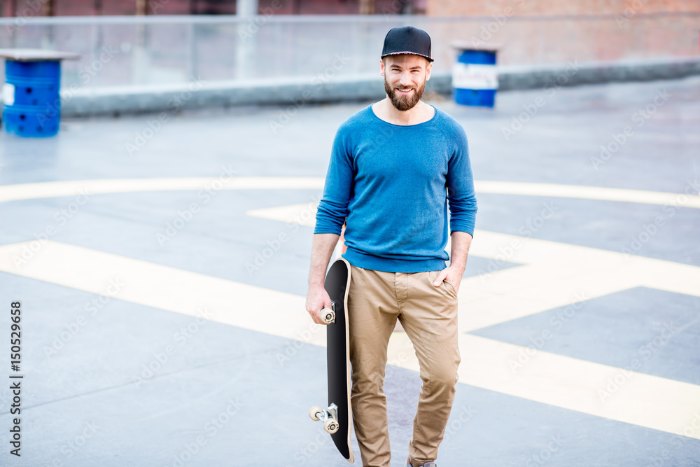 Portrait of a man with skateboard