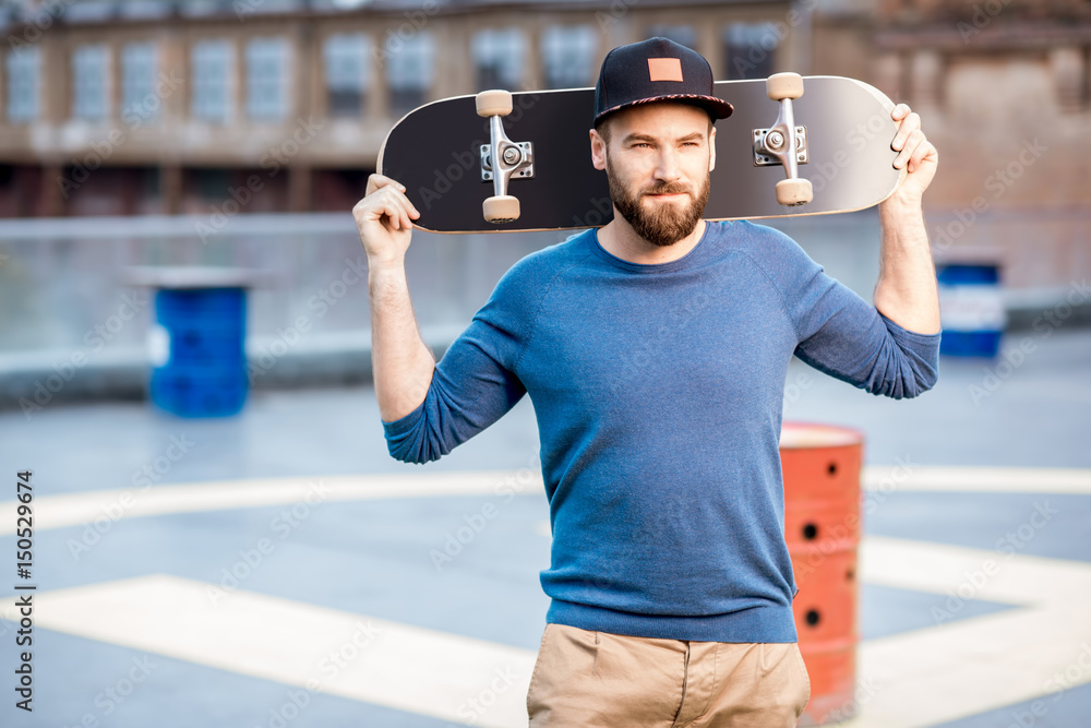 Portrait of a man with skateboard