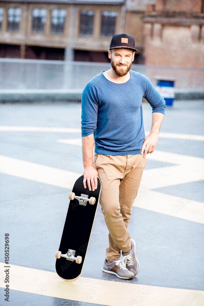 Portrait of a man with skateboard