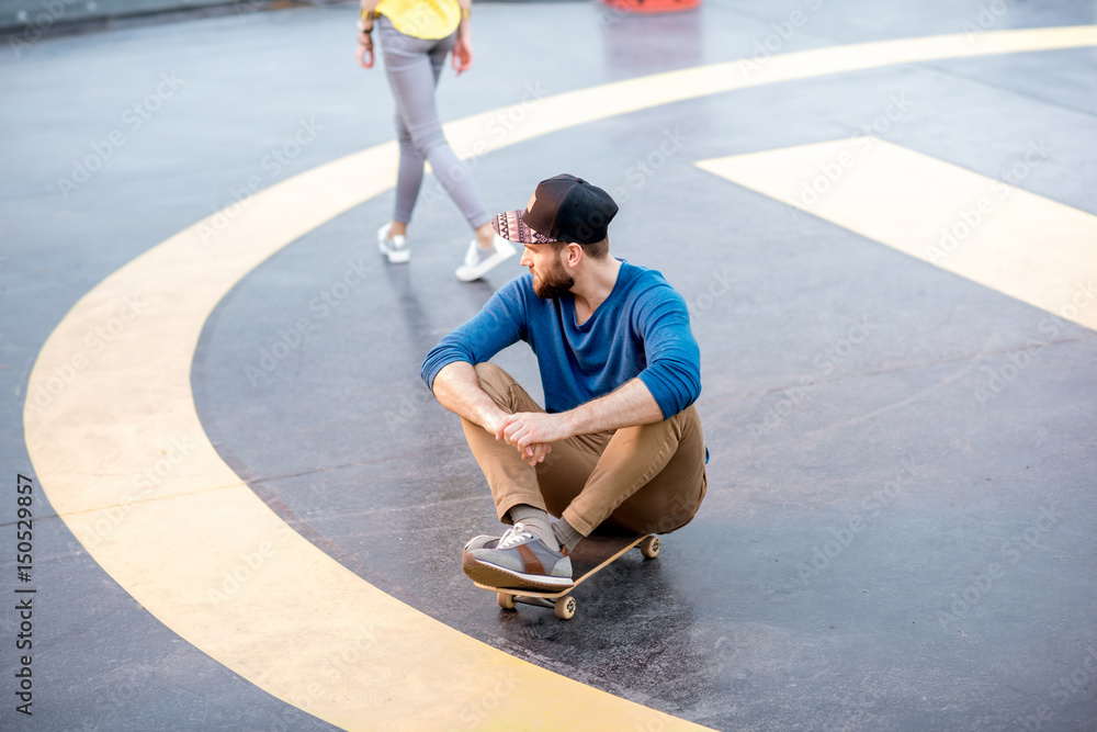 Portrait of a man with skateboard