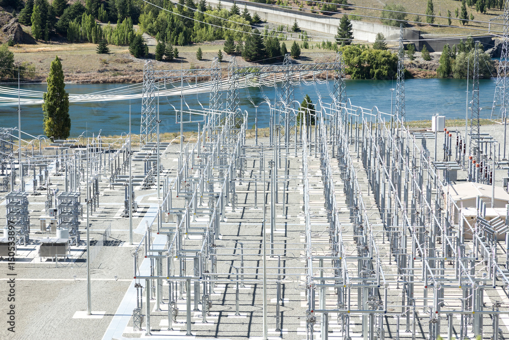 power transmission station near river in summer day