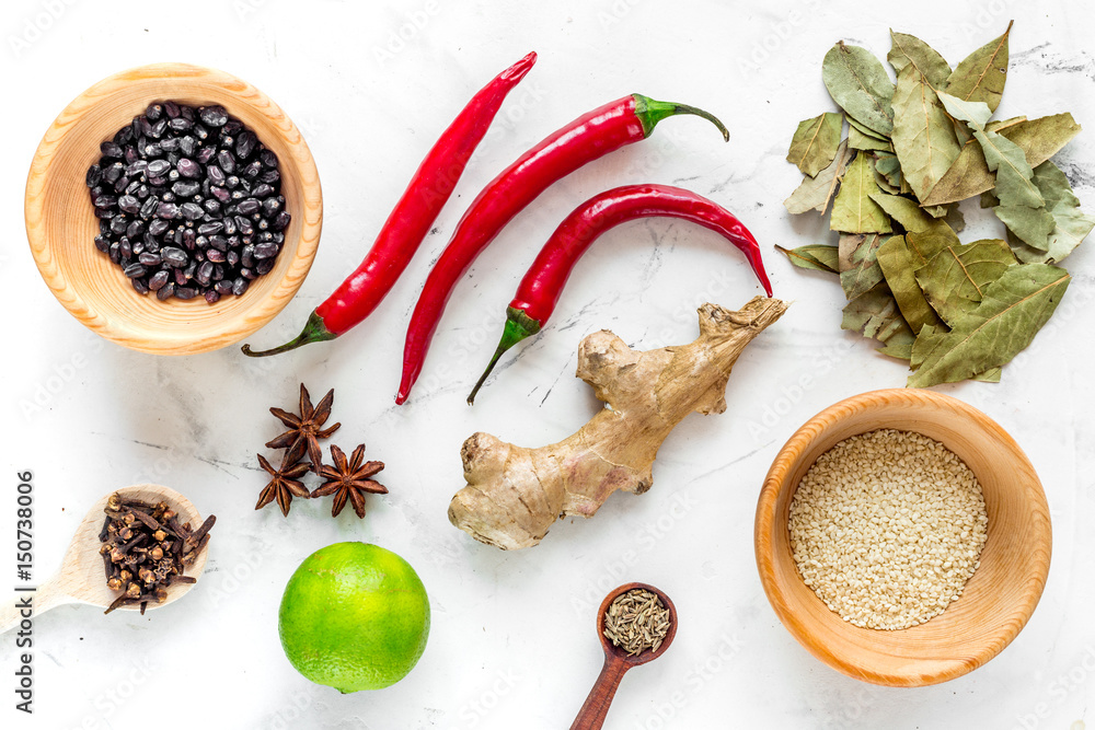 Cooking with spices, salt and pepper on kitchen table background top view