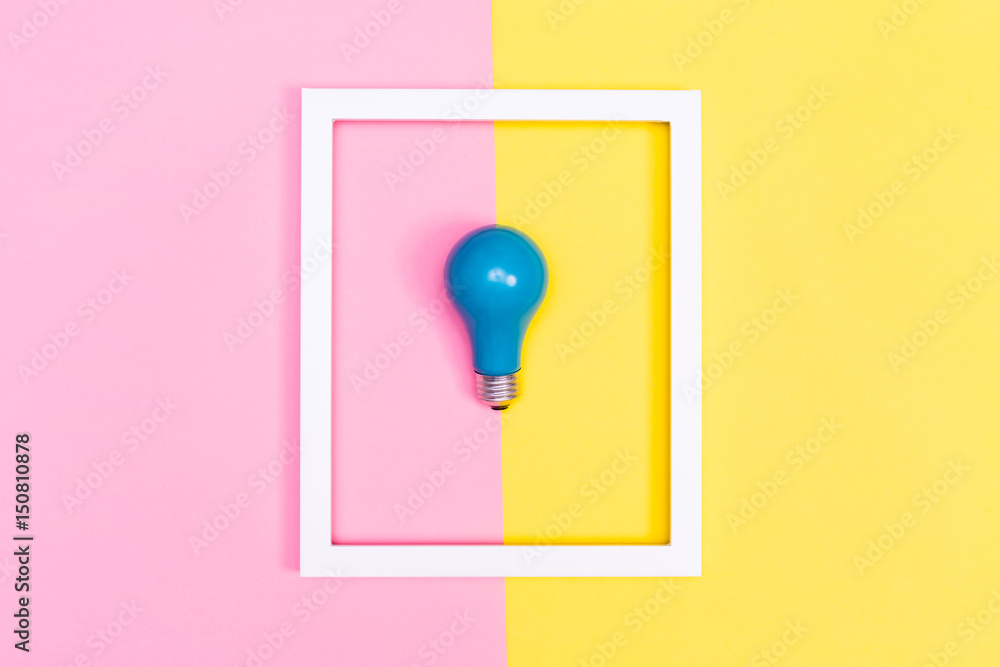 Colored lightbulb on a duotone background